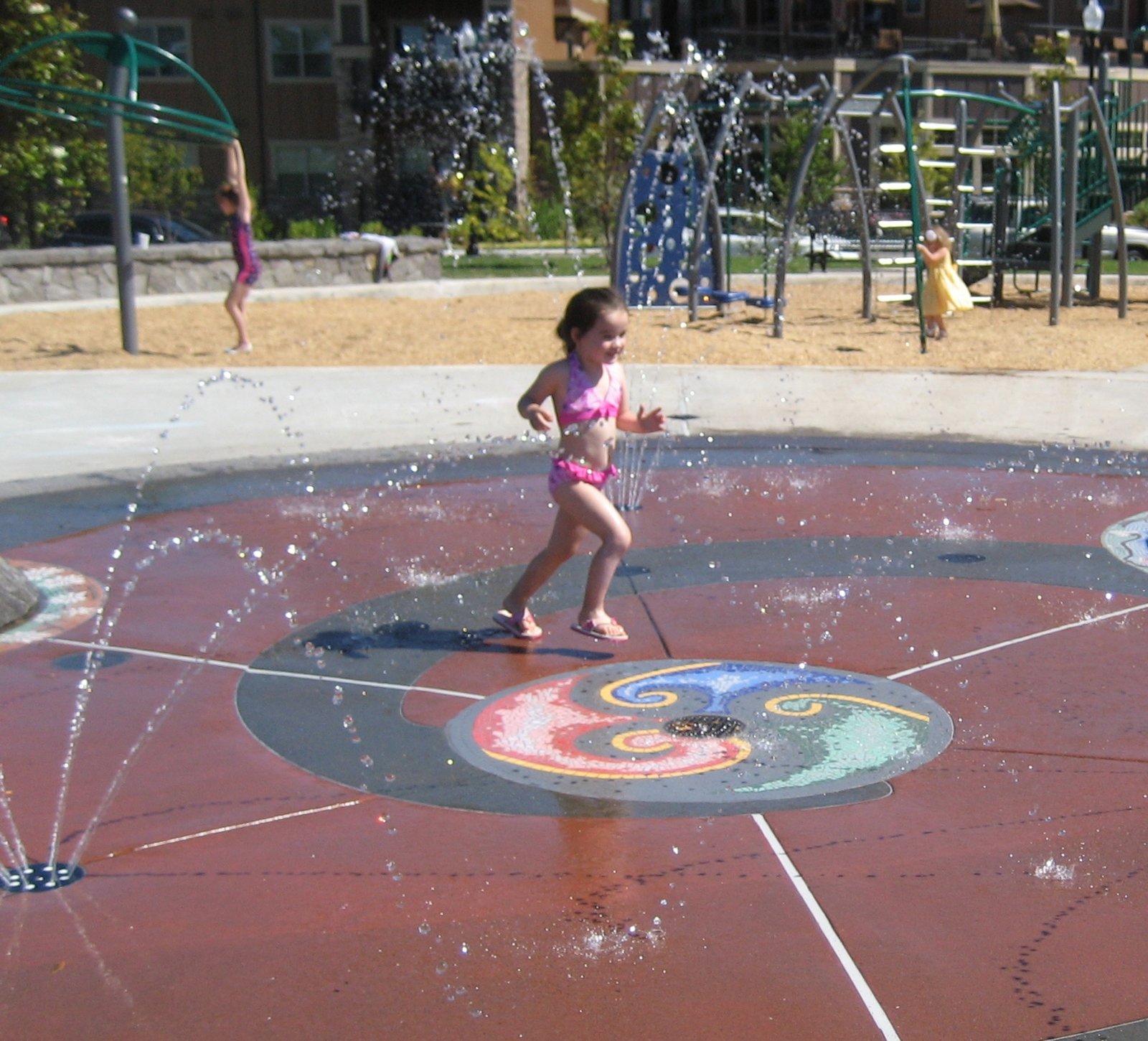 Children playing in the splash pad at Magnolia Park, Hillsboro